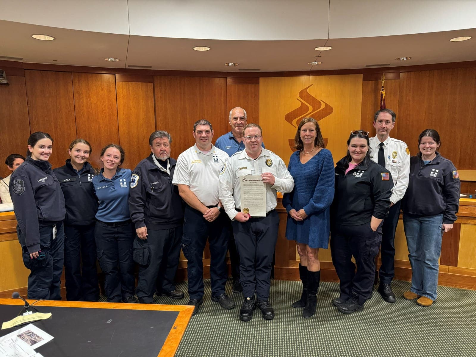 Summit Volunteer First Aid Squad members gather with Mayor Elizabeth Fagan at the October 6 Common Council meeting to mark the squad’s 64 years of service.
